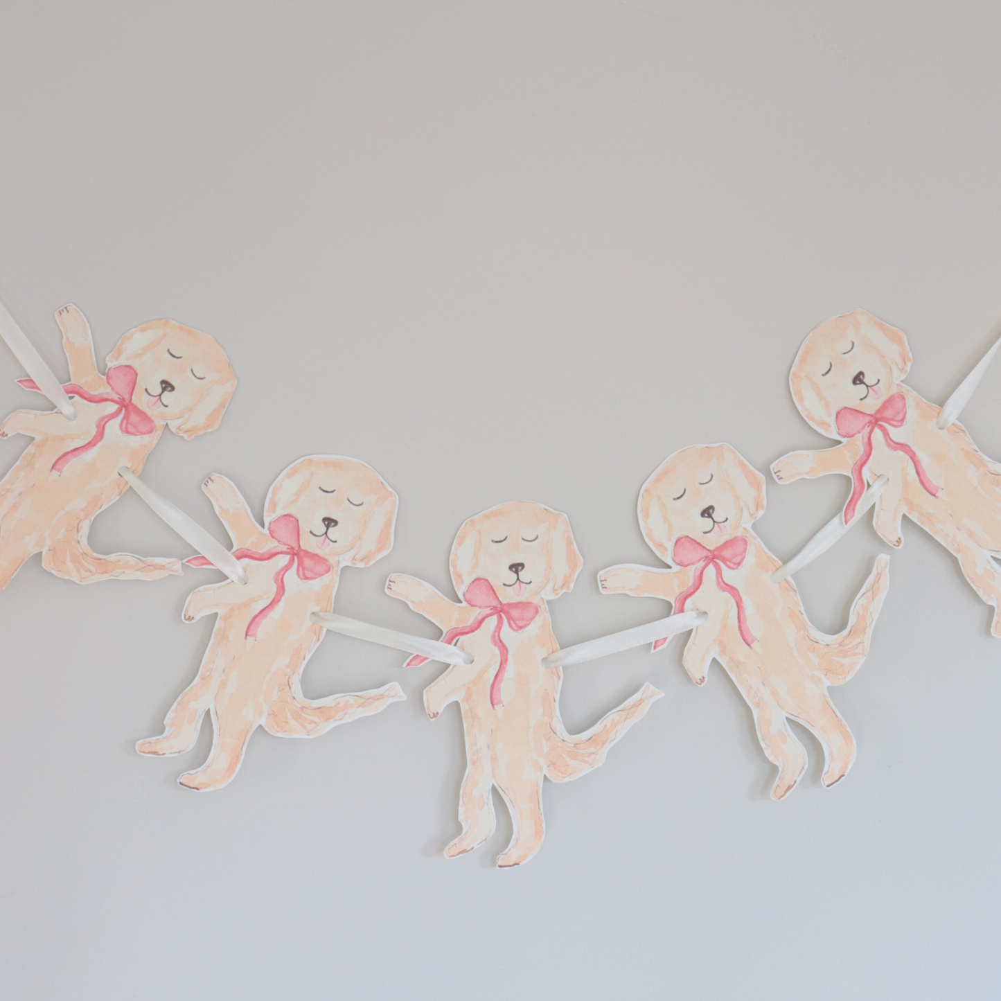 Decorative banner with illustrations of dogs wearing pink bows on a light gray background