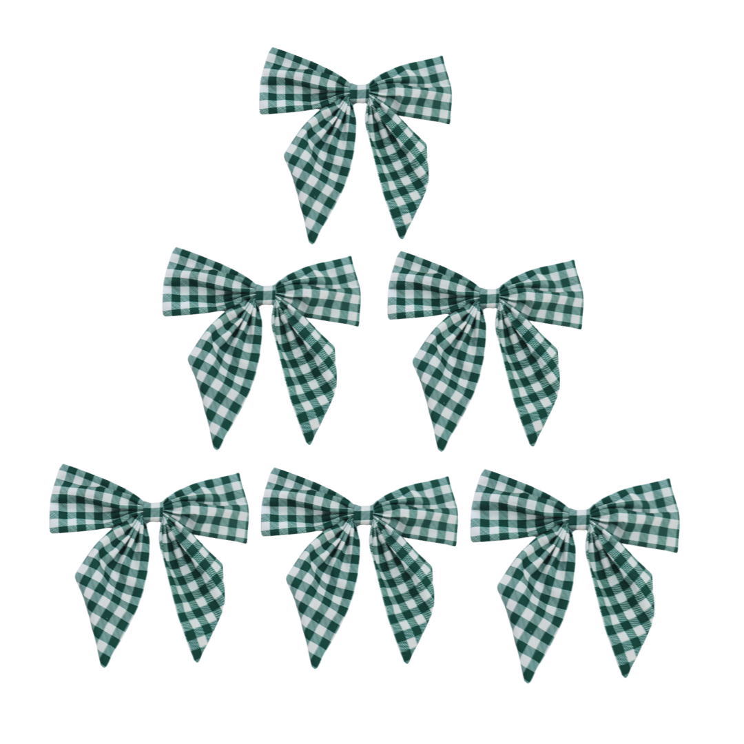 Set of green and white checkered bows on a white background