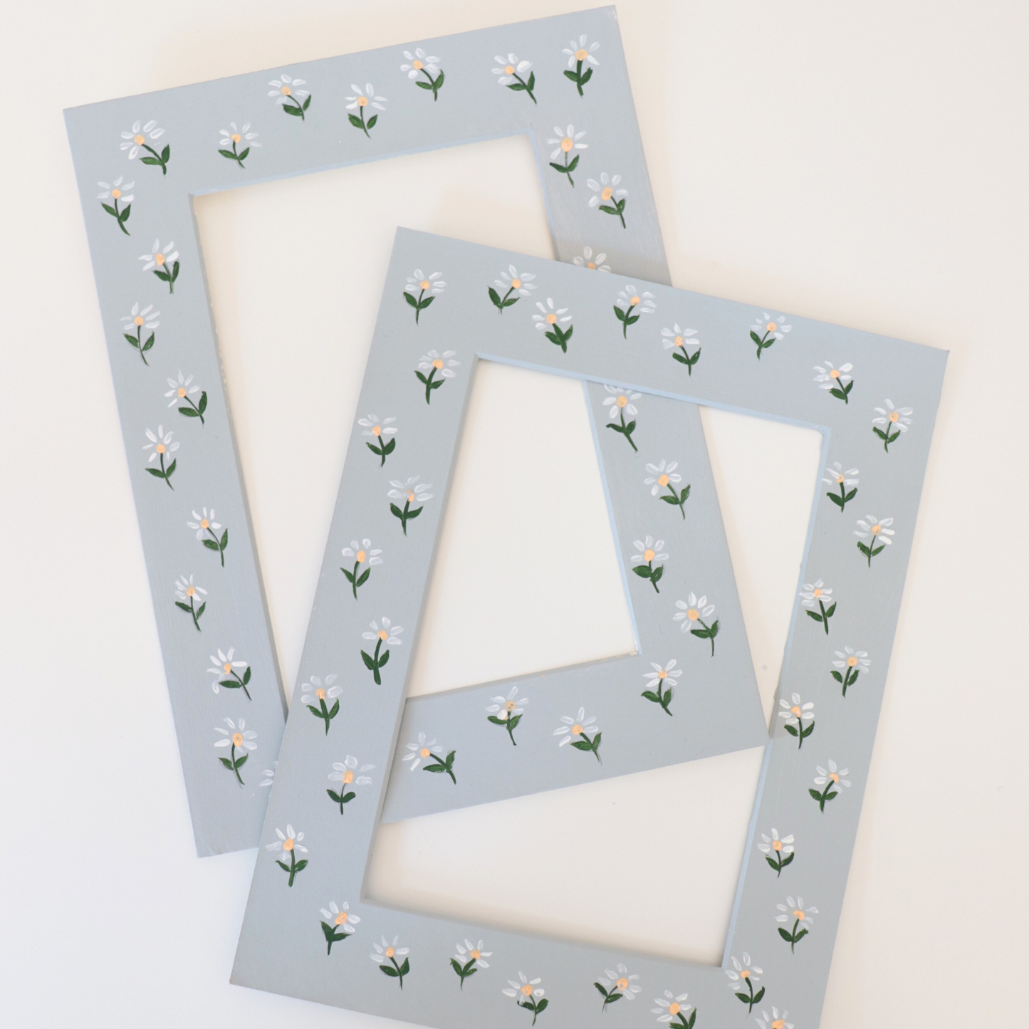 Two floral picture frames on a white background