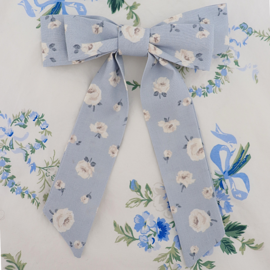 Floral-patterned bow tie on a floral background
