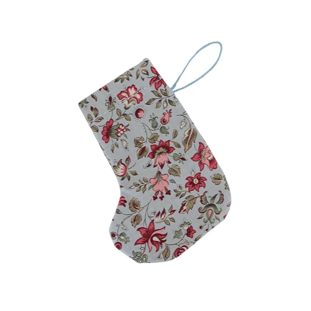 Floral-patterned stocking on a white background