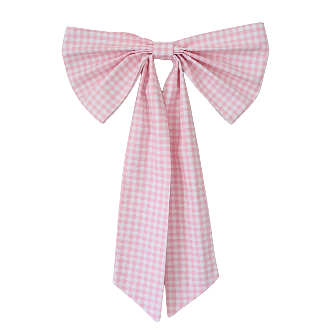 Pink gingham bow on a white background