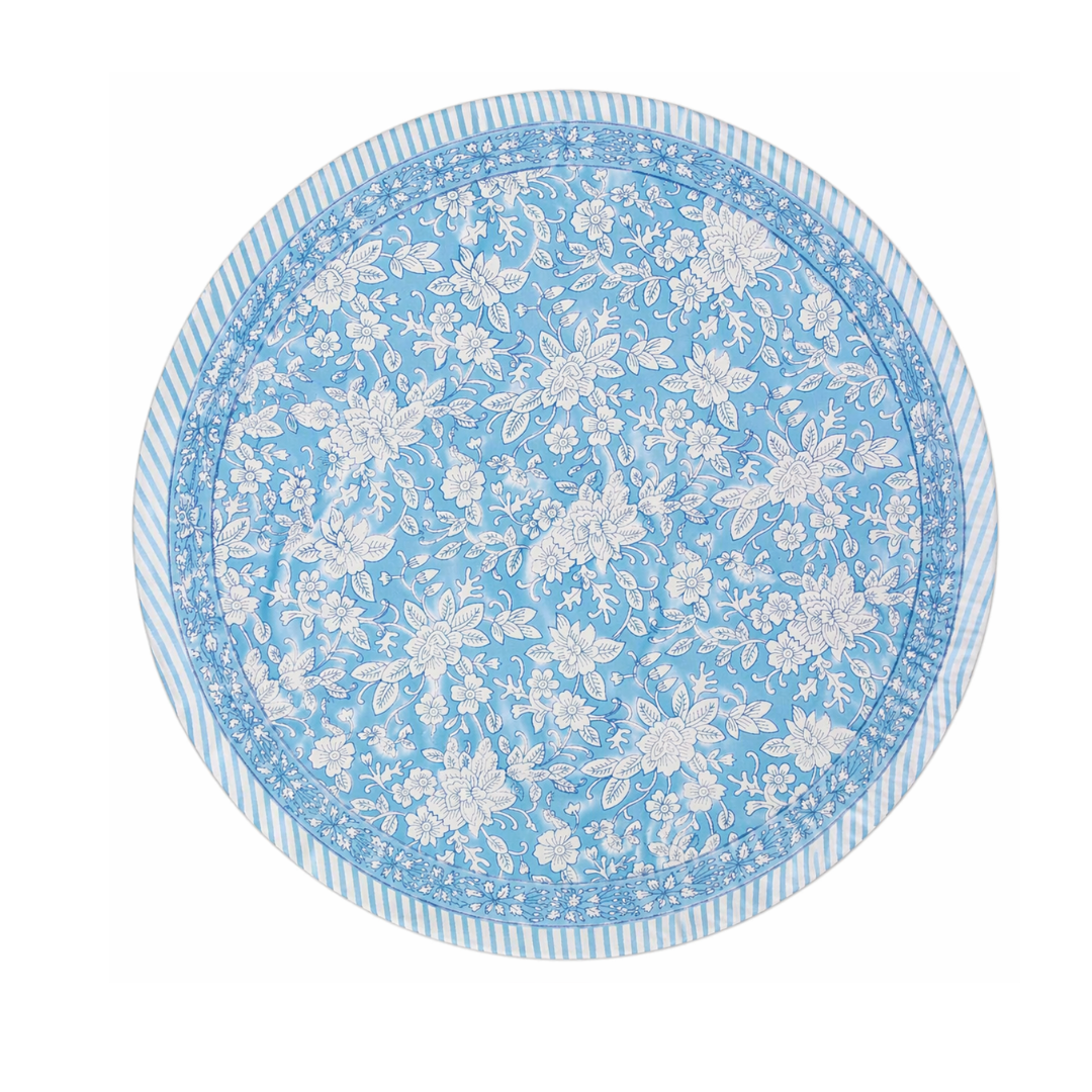 Round blue tablecloth with white floral pattern on a white background
