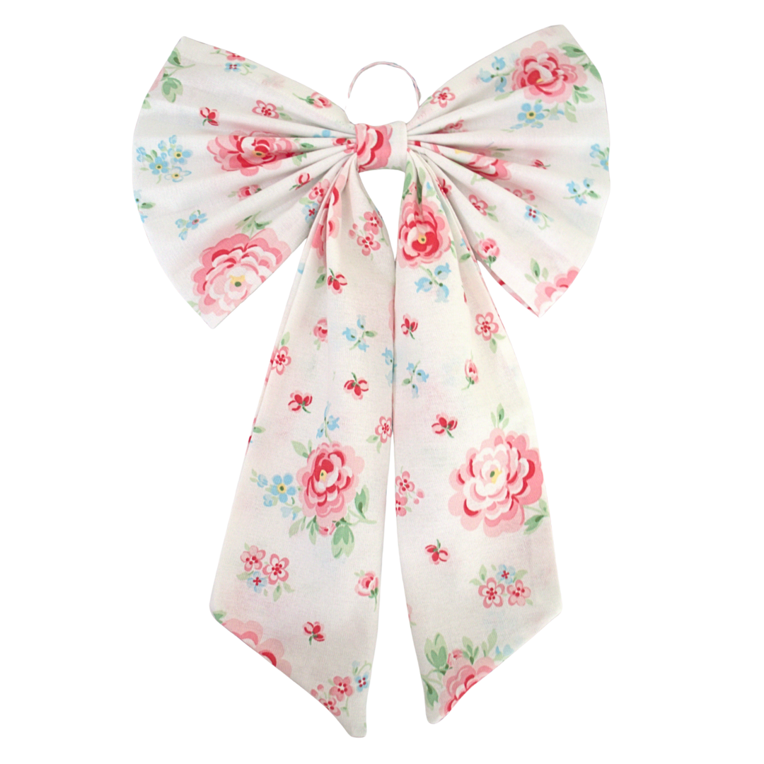 Floral bow hair accessory on a white background