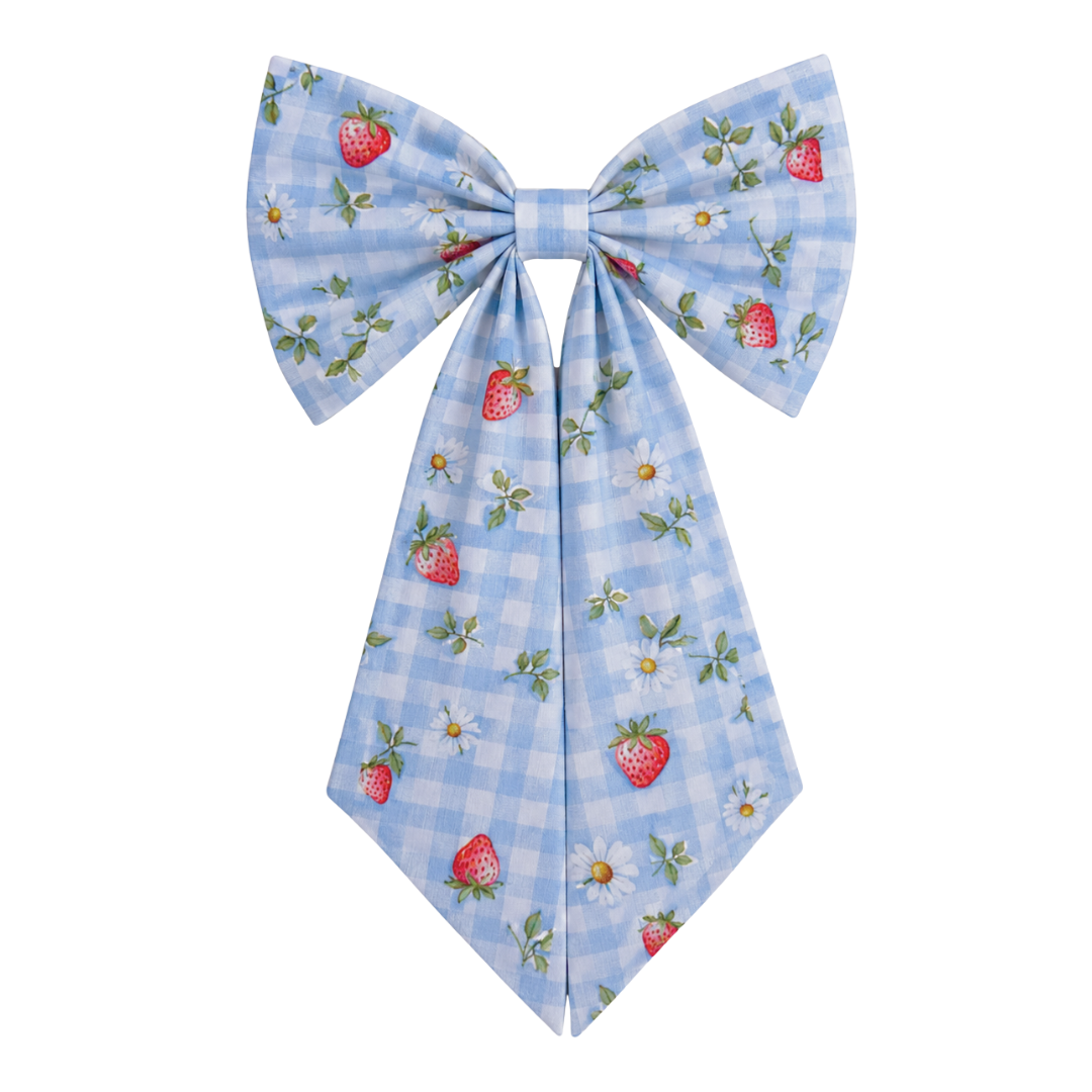 Large bow with strawberry and checkered pattern on a white background