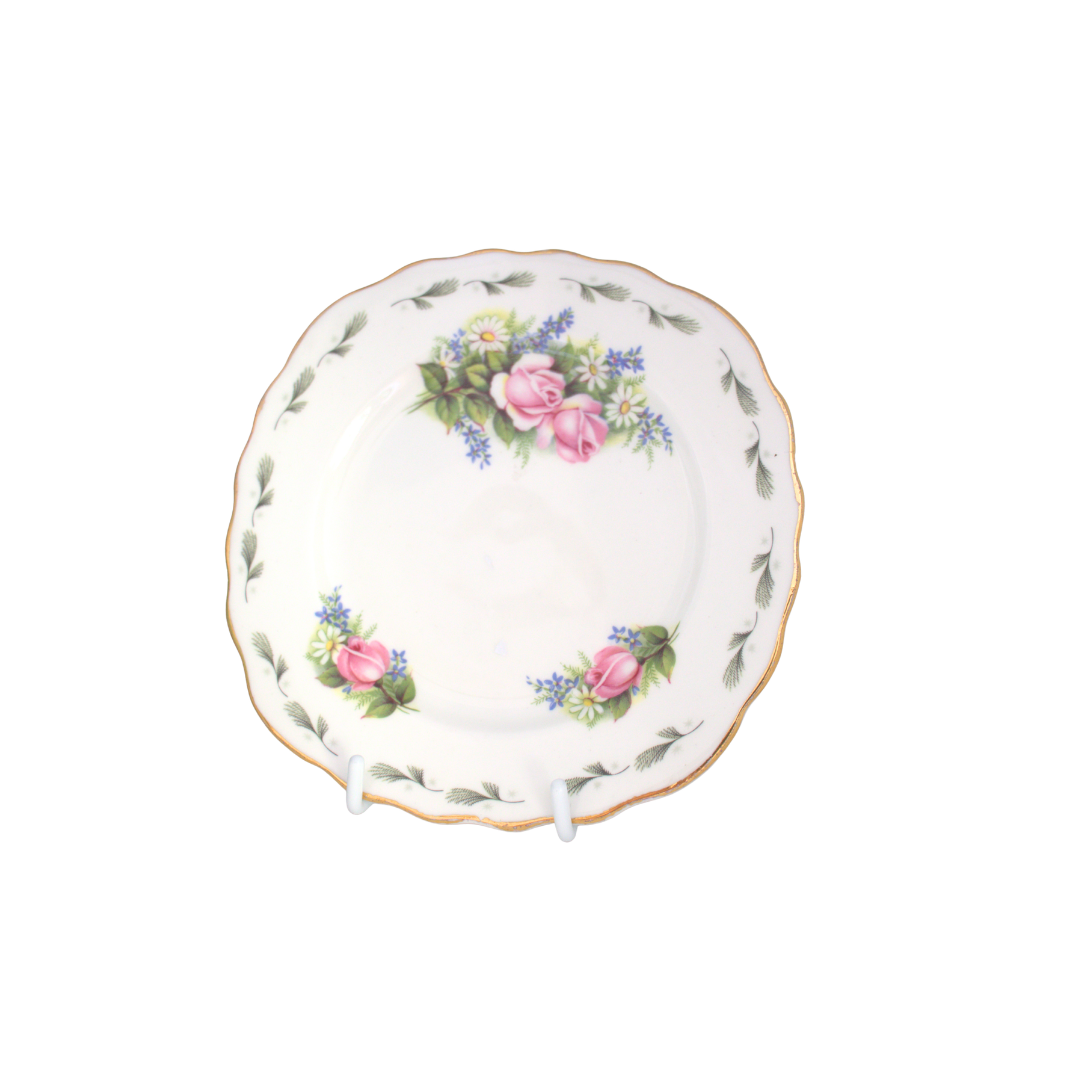Decorative ceramic plate with floral design on a white background