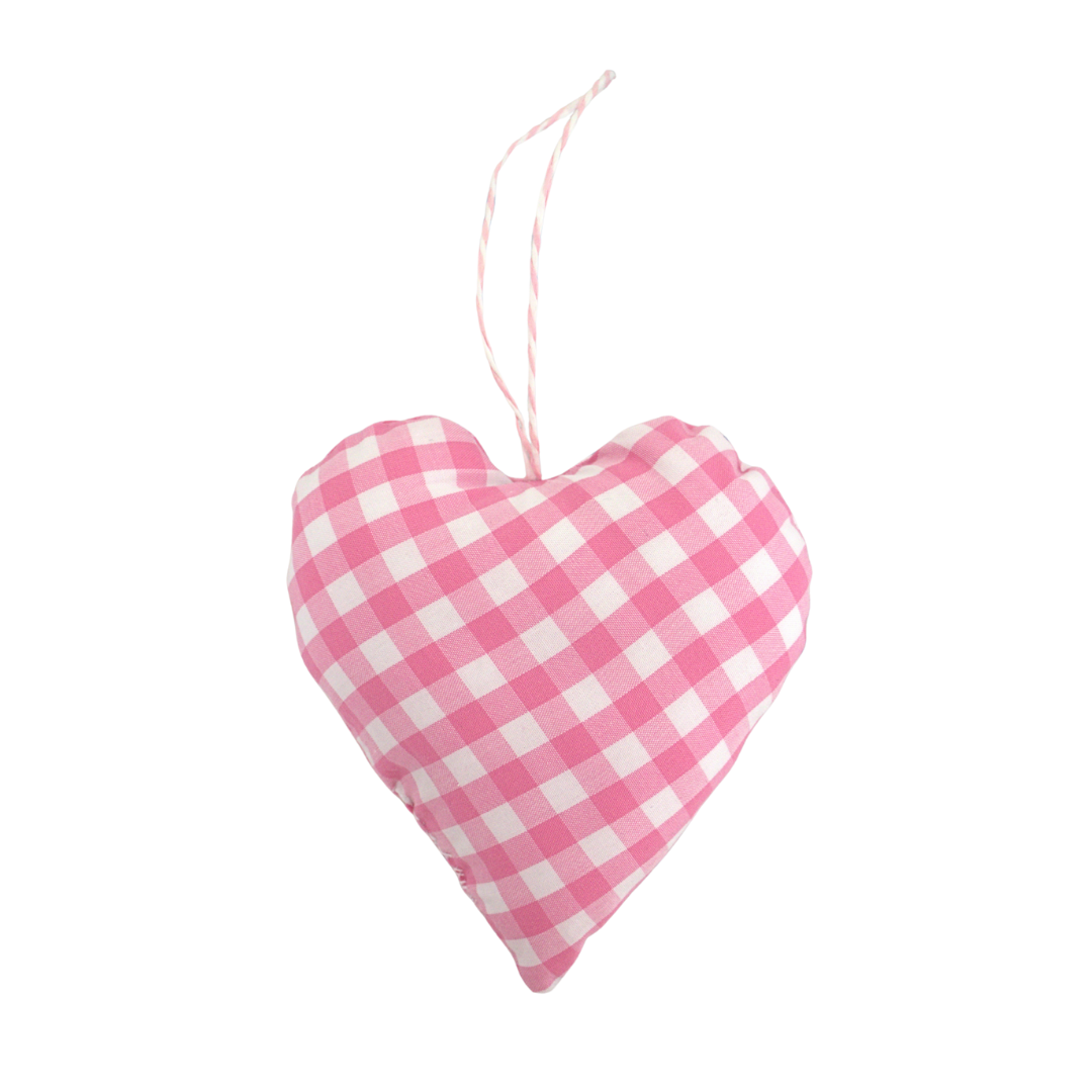 Pink and white checkered heart-shaped decorative item on a white background