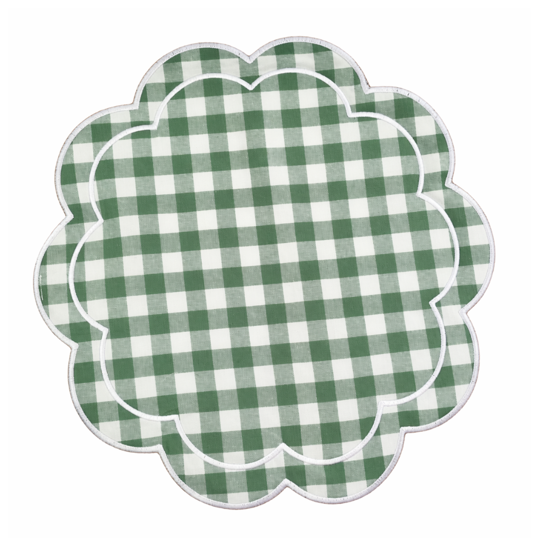 Green and white checkered scalloped placemat on a white background